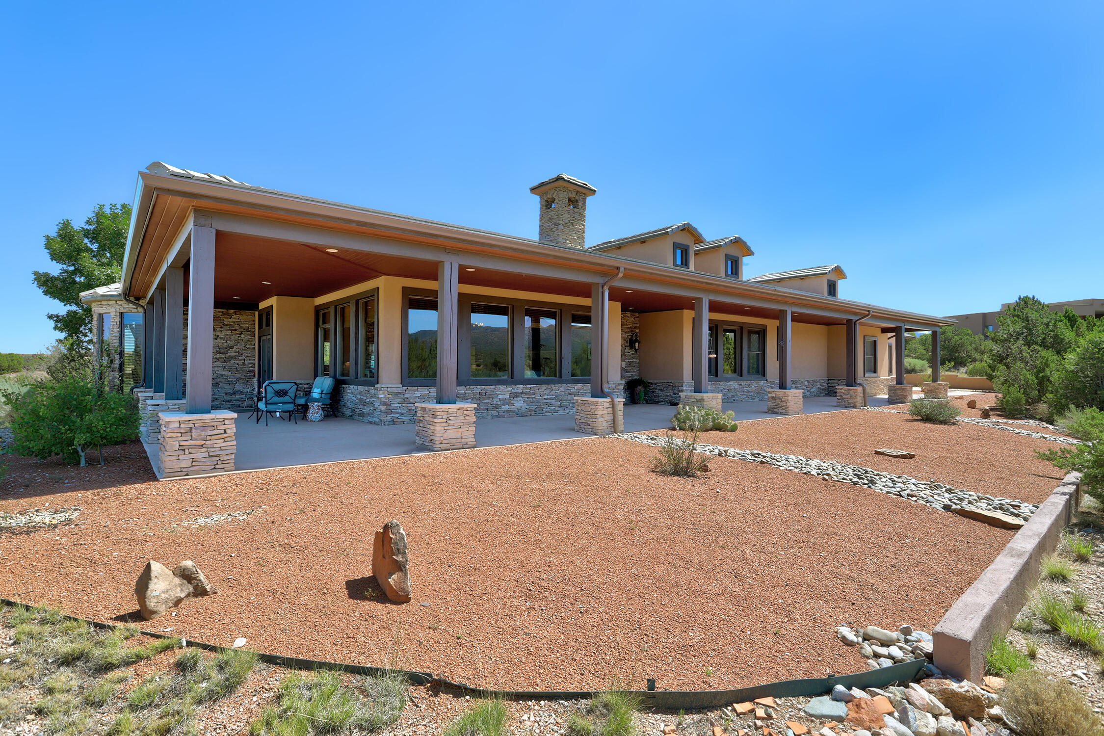Discover the hidden gem of San Pedro Overlook, a gated master-planned mountain community offering a cool climate similar to Santa Fe with the convenience of Albuquerque just minutes away. Residents enjoy paved roads, shared community wells, a clubhouse, community pool, large homesites, breathtaking mountain and valley views, and a true sense of community.Situated on 3.3 private acres, 17 Turquoise Dr features a beautifully designed custom home with 3 bedrooms, 2.5 baths, a dedicated office, and a gourmet kitchen with quality finishes. Enjoy indoor-outdoor living with covered verandas, a cozy fireplace, and spectacular panoramic views. Additional features include an epoxy-finished 3-car garage, a finished bonus room off the garage ideal for a studio, gym, or hobby space, and the privacy and tranquility that make mountain living so desirable. Experience custom craftsmanship, exceptional amenities, and stunning scenery in one of the East Mountains' premier communities.