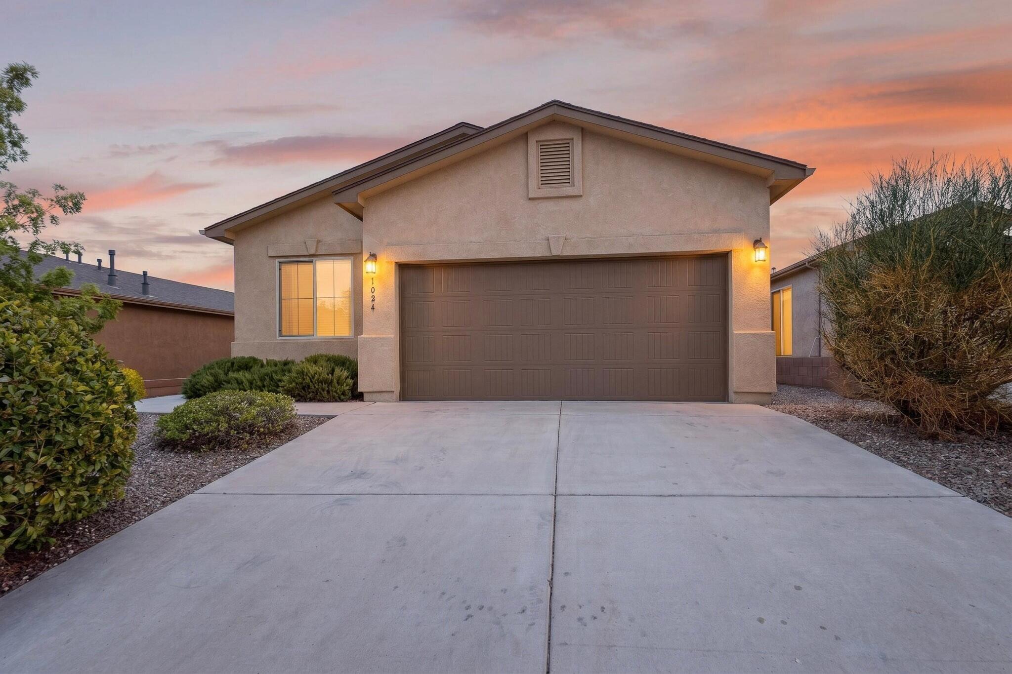 Welcome home to this move-in ready single-story, where 3 bedrooms and a versatile home office come together in a smart split floor plan. The kitchen shines with granite countertops, rich wood cabinetry, a mosaic tile backsplash, a center island, and a full black appliance package -- all flowing into an open living, dining, and kitchen area thoughtfully designed around the space where you'll spend the most time. Natural light pours in, and sliding glass doors frame views of the Sandia Mountains. The primary suite offers a dual-vanity bath, a glass-enclosed walk-in shower, and a large walk-in closet. Step outside to a covered patio overlooking a large backyard that, with a little imagination, could become a stunning retreat -- all just minutes from trails, parks, city events and activities centers, shopping, dining and medical facilities!