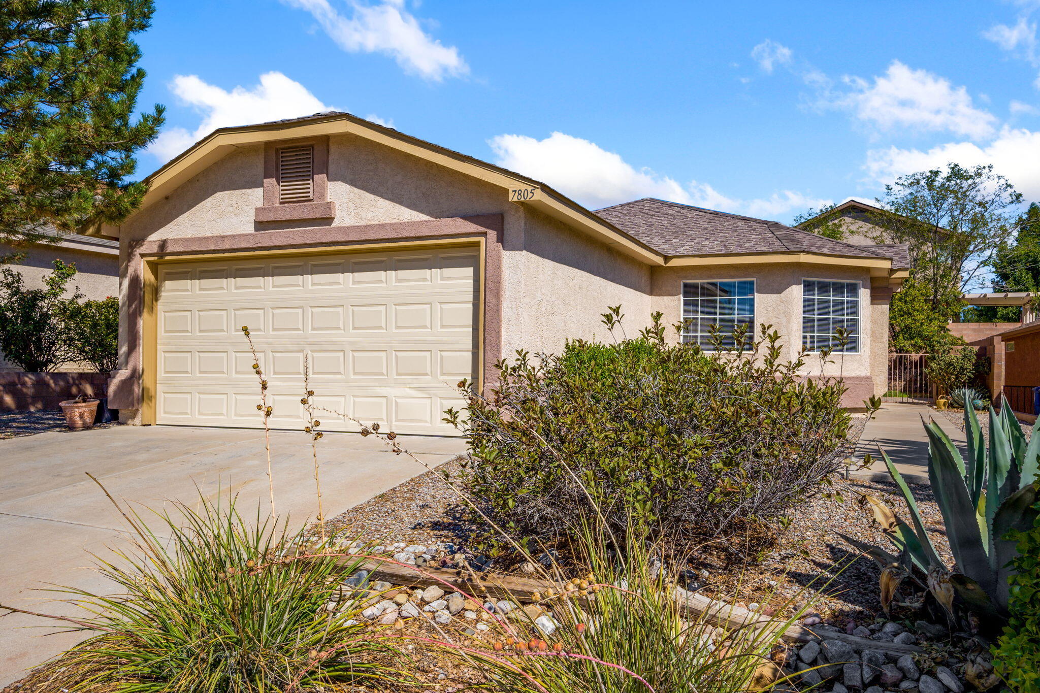 Welcome to this move-in-ready property in the heart of Paradise Hills! This bright 3-bed, 2-bath single-story home has been thoughtfully refreshed from top to bottom, featuring brand-new kitchen appliances, fresh interior paint, new flooring, updated bathroom fixtures, new blinds, new door handles and doorstops, and new smoke detectors for added peace of mind. You'll find spacious bedrooms, an open floor plan, tall ceilings, and ample storage throughout! Solar panels reduce monthly energy bills (with no monthly lease fee - pay what you use), and refrigerated air will keep you feeling refreshed in the New Mexico heat!Step outside to a refreshed backyard complete with your very own apple and apricot trees and recently updated landscaping. Enjoy homegrown goodness, right at your fingertips! Whether you're relaxing indoors or enjoying the backyard, this home has it all.Within just a 2-mile radius, you'll find: Cibola Loop Multigenerational Center, with a future library and pool planned. Bernalillo County's South Coors Boulevard Sector Plan is introducing new mixed-use zoning to create walkable centers along the Coors corridor that runs directly past Paradise Hills. Love the great outdoors? You'll find Paradise Hills Golf Course (Albuquerque's only privately owned public golf course) is within a short drive, as is the Petroglyph National Monument. Don't forget about parks, walking trails, shopping, dining, and major roadways. Welcome home to 7805 Latir Mesa!
