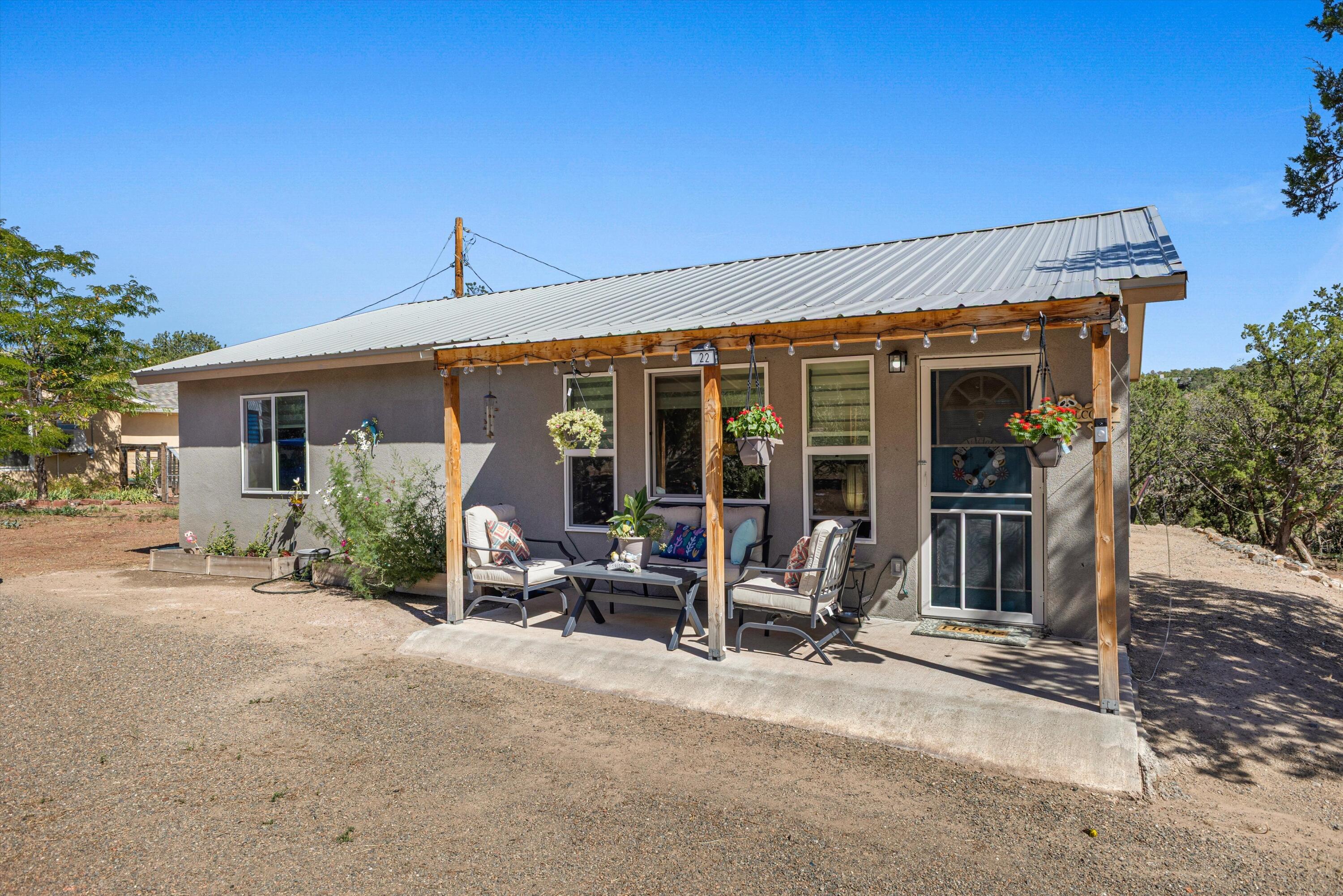 Nestled in the tranquil community of Sandia Park, this charming single-family home sits on a private 0.47-acre lot offering a quiet mountain retreat feel with easy access to both Albuquerque and Santa Fe. Featuring 1,014 sq. ft. of comfortable living space, this home includes 2 bedrooms and 1 bathroom. Built in 2024, the residence presents a great layout with bright interiors, making it an ideal starter home, mountain getaway, or investment opportunity. Enjoy serene surroundings, beautiful scenery, and open skies right from your own property. Located within a desirable school district (served by San Antonito Elementary and Roosevelt Middle School). Don't miss this opportunity to own a piece of peaceful East Mountain living!