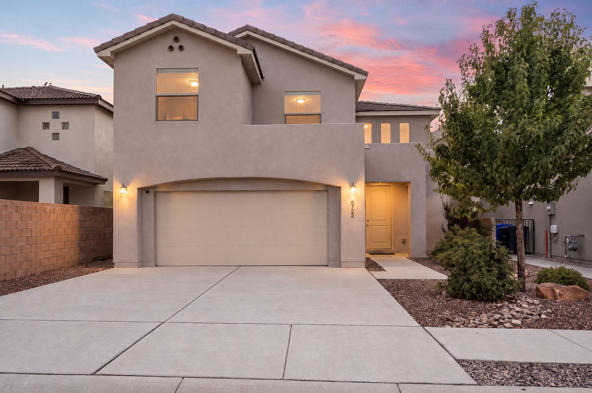 Welcome to the Highly Desired Gated Community of Sevano!  Dual Primary bedrooms in this home is superior and perfect for multi-generational living! Designed with both everyday living and entertaining in mind, this two-story home offers an abundance of natural light, soaring ceilings, and attractive wood-look tile throughout the main living areas. The kitchen is a natural gathering place, featuring a large center island with bar seating, chefs kitchen with built-in appliances, and plenty of workspace. The spacious downstairs primary suite provides a relaxing retreat with a generous walk-in closet and an ensuite bath complete with dual sinks, a soaking tub, and separate shower. Multiple flexible living spaces make it easy to customize the home to fit your lifestyle. A loft and additional bonus room offer endless possibilities for a home office, media room, game room, second living area, or guest space. Step outside onto the balcony from the second primary bedroom with its own bathroom and enjoy beautiful mountain views. The backyard adds even more to love with a covered patio, putting green, and thoughtfully landscaped outdoor space perfect for relaxing or entertaining. Come see all the space, versatility, and views this NE Heights home has to offer. Schedule your private showing today!