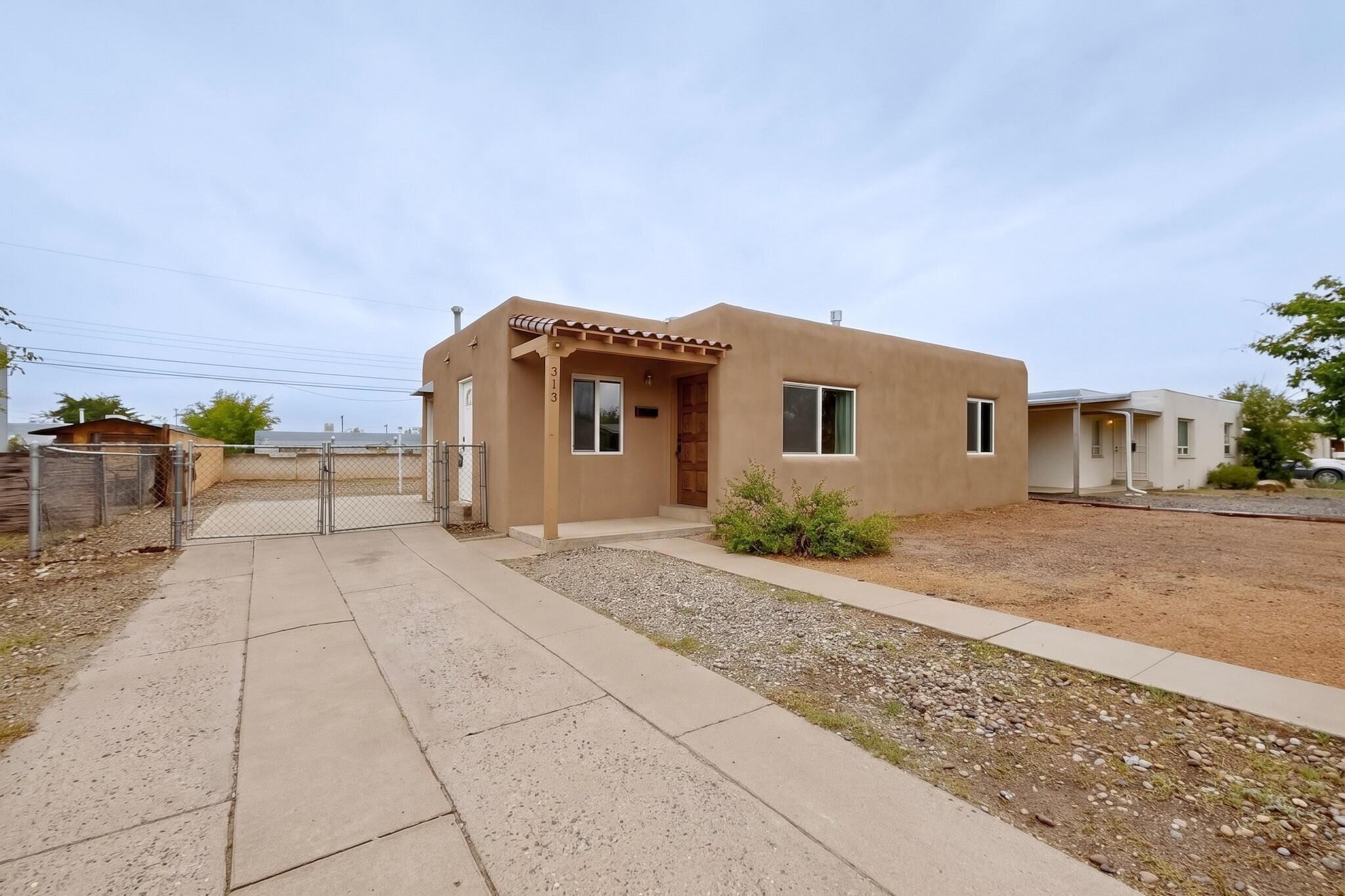 Photo 2 of Single family home for sale at 313 General Bradley St Ne, Albuquerque, NM 87123 | MLS# 1111739 | Listing updated on 2026-10-21