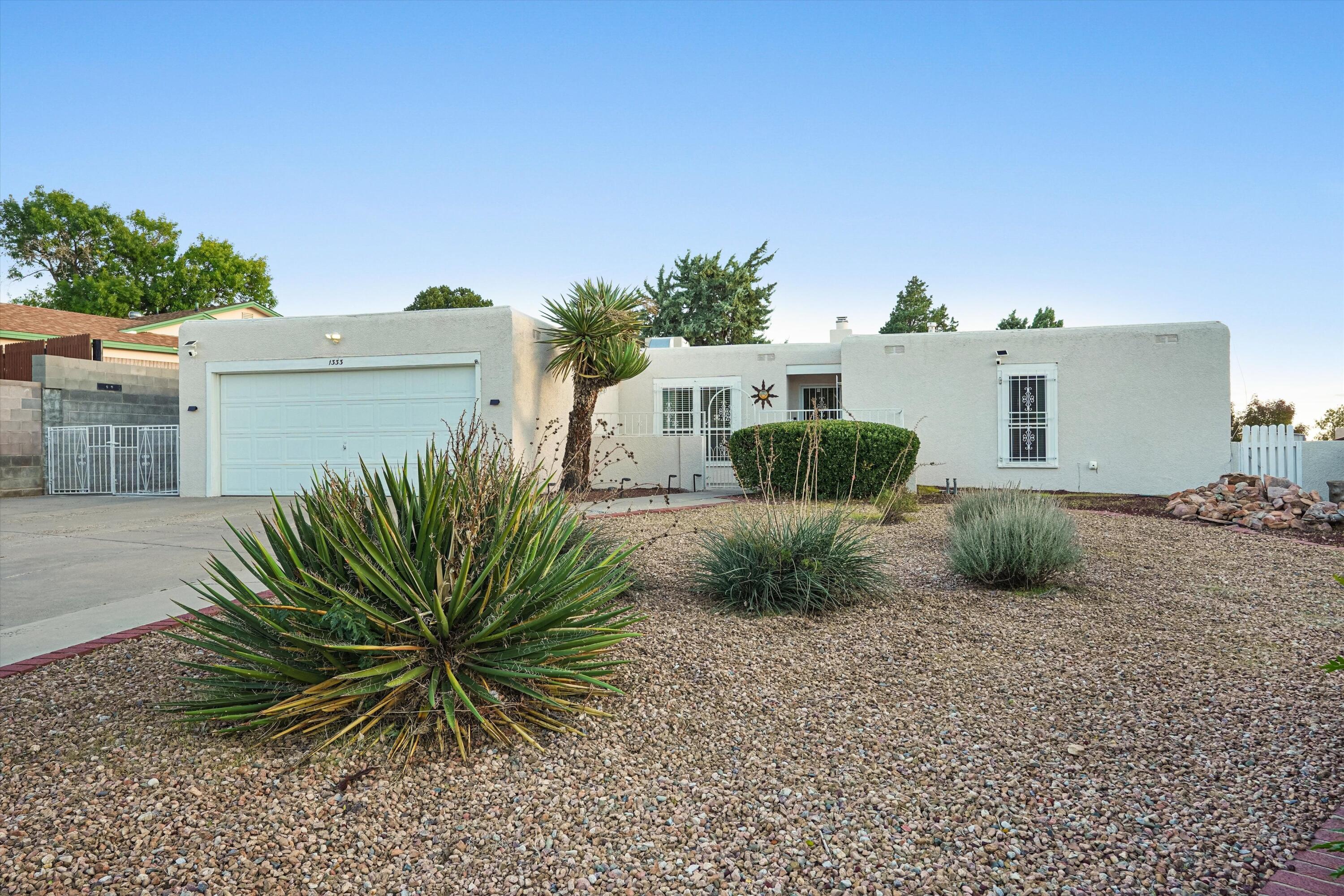 Set in Albuquerque's coveted Foothills South neighborhood, this Pueblo-style residence pairs timeless Southwestern architecture with easy, elegant single-level living. Spanning 2,054 square feet, the home offers 4 bedrooms, 3 baths, and multiple living areas that flow gracefully for both quiet evenings and entertaining. Skylights fill the interiors with soft natural light, while the beautiful fireplace sets a warm, inviting tone. The primary suite is a true retreat, complete with a generous walk-in closet.Outdoors, the 0.32-acre lot becomes a private resort. A sparkling pool anchors the walled backyard, and the covered patio is made for al fresco dining and long desert sunsets. RV access with hookup and an attached 2-car garage add rare convenience to the home's refined appeal.With its distinctive character, gracious layout, and prized foothills setting, this is an exceptional opportunity to own a home that feels both elevated and effortlessly livable.